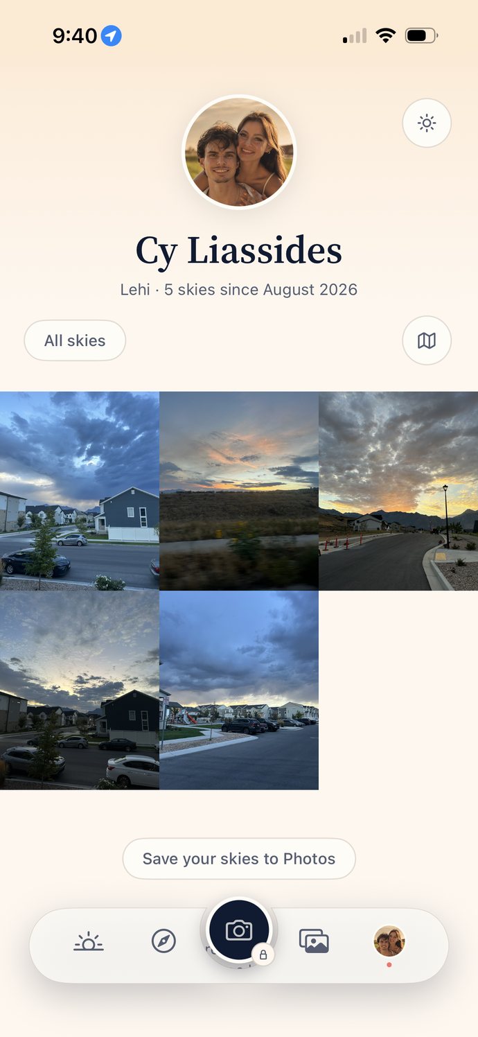 A Skysta profile on a warm cream page: a round photo, the name Cy Liassides, the line Lehi and 5 skies since August 2026, an All skies filter and a map button, then a mosaic of five sunrise and sunset photographs taken around a neighbourhood.